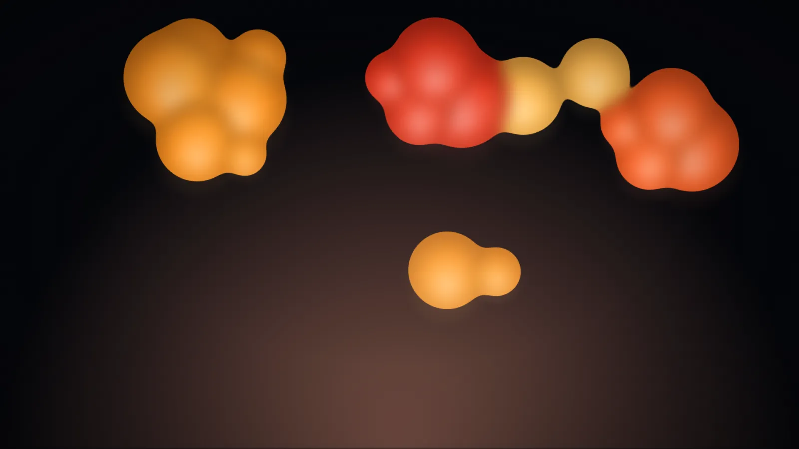 Lava on the classic palette: soft-edged orange and red blobs on black, drifting and merging.