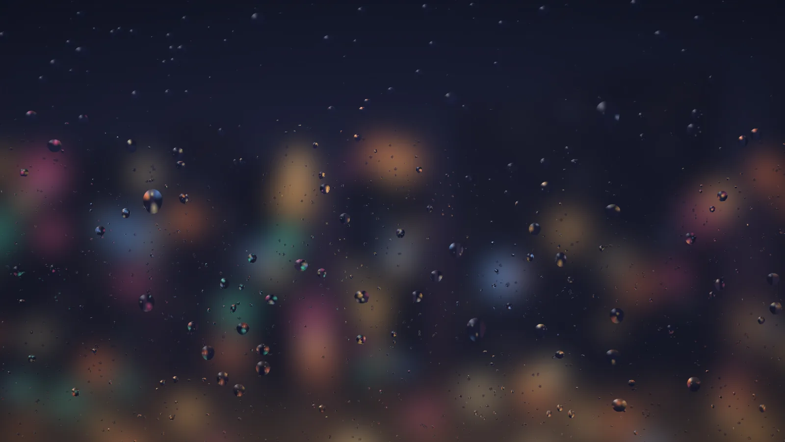 Pane looking out on the city scene: a dark navy sky over soft bokeh blobs of orange, pink, teal and blue, with small drops on the glass, many of them picking up flecks of colour from the lights behind.
